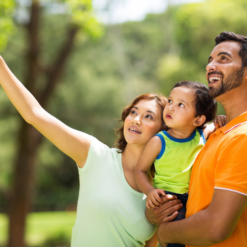 family looking up with mother pointing finger